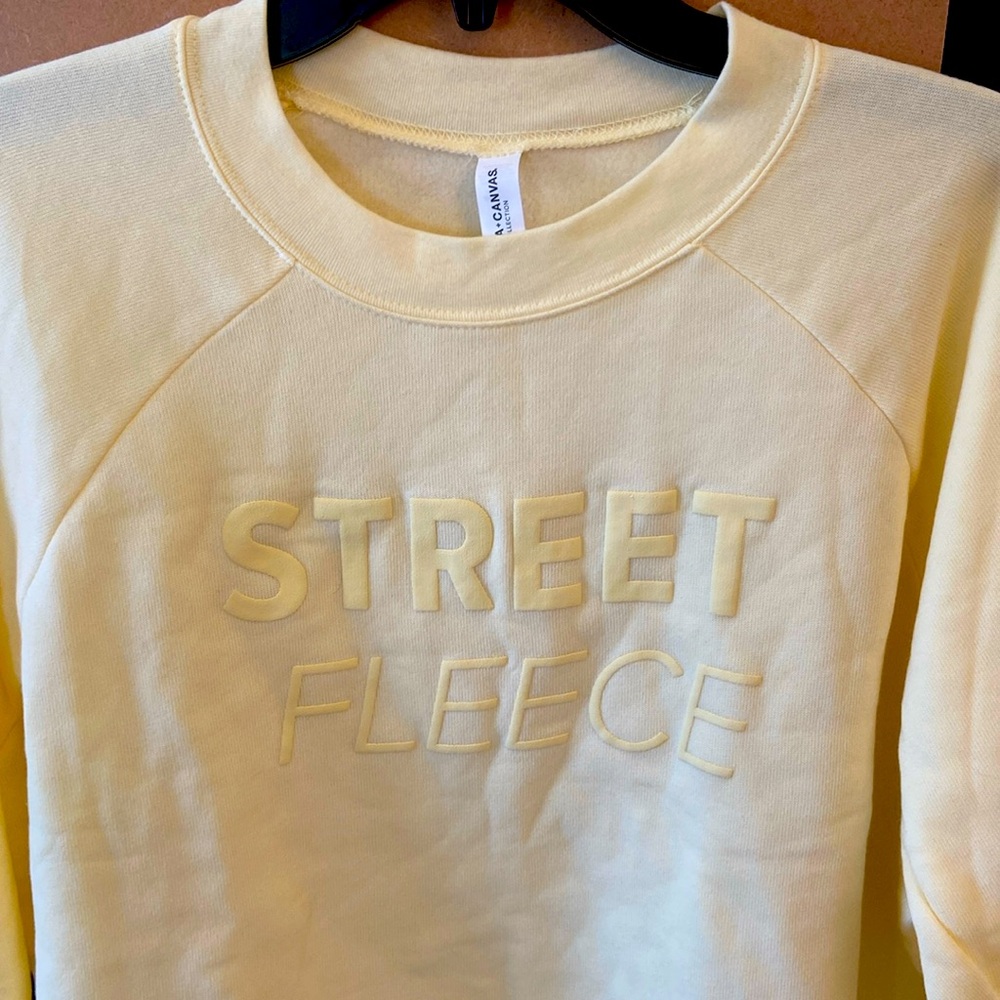 NWOT Juniors soft yellow sweatshirt L